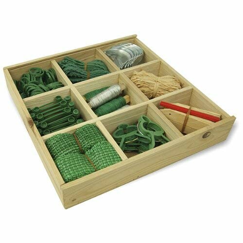 Wooden organizer box with garden tools and accessories.