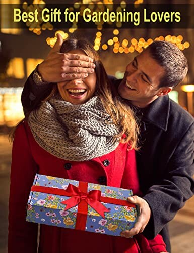 Man surprising woman with gift box outdoors.