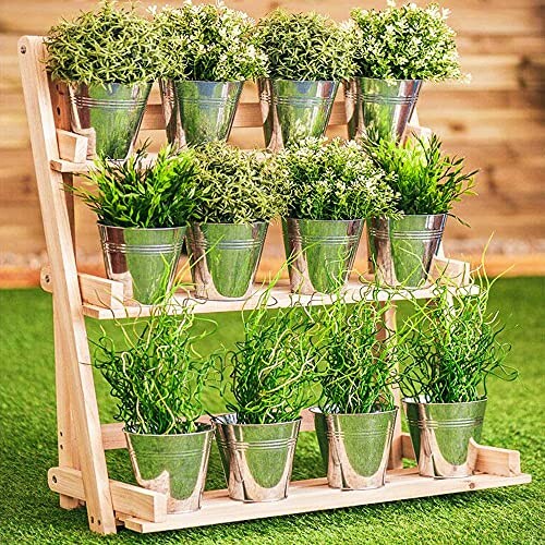 Wooden shelf with metal pots containing various green plants.