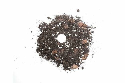 A pile of soil with a circular hole in the center on a white background.