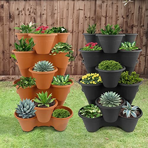 Two tiered planters with various succulents and flowers in a garden setting.