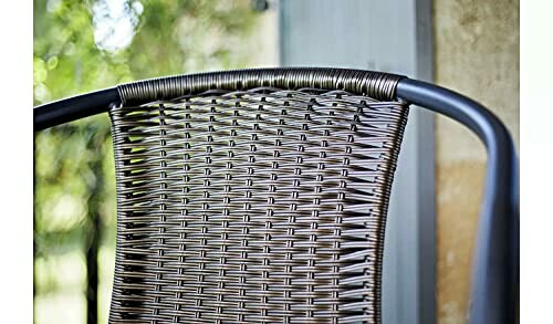 Close-up of a wicker chair backrest outdoors.