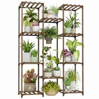 Wooden plant stand with multiple potted plants in a variety of sizes and types.